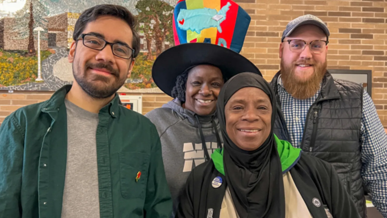 Stack of children's books and coloring supplies distributed at the free literacy event