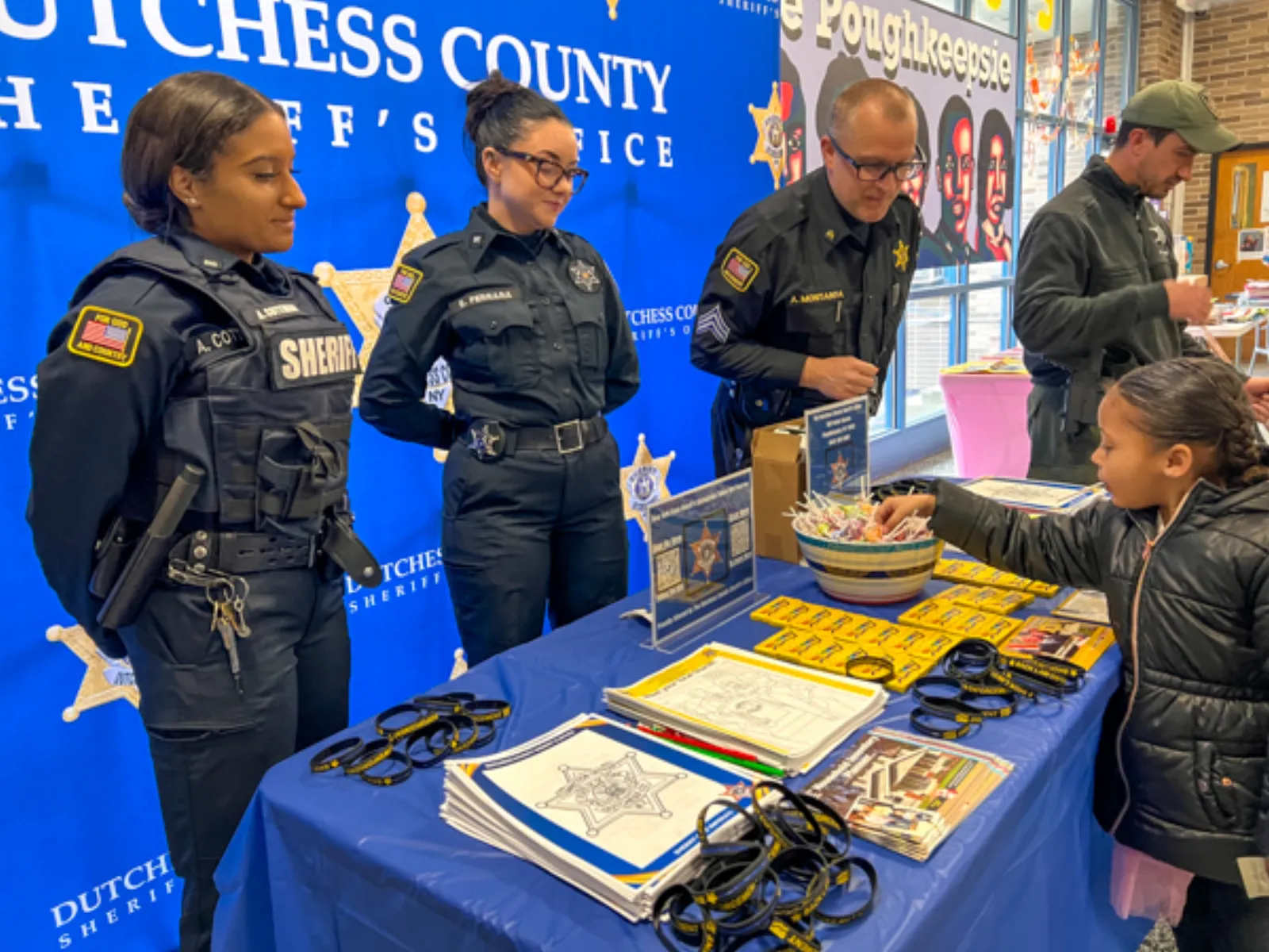 Kids engaged with their new books at the annual community reading event