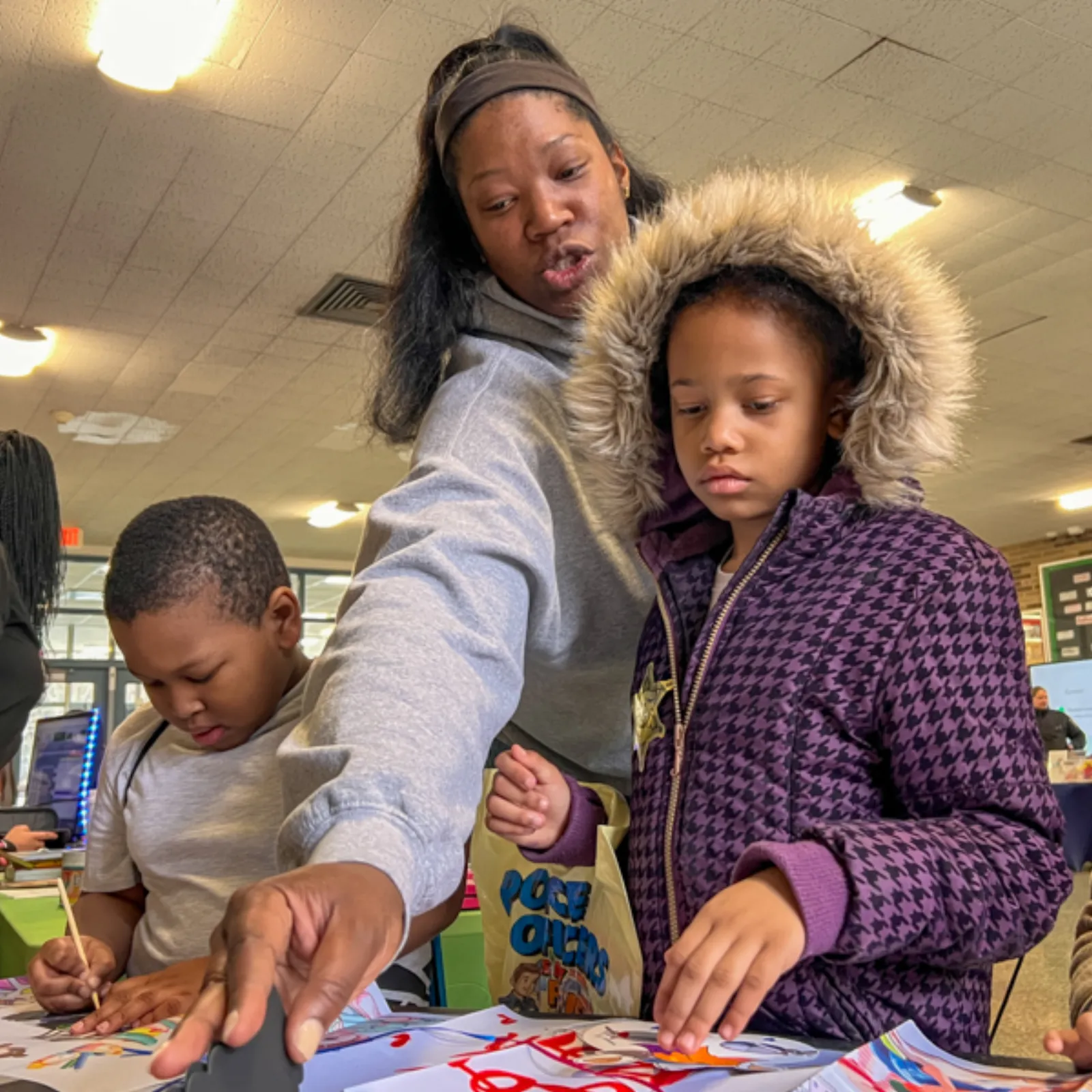 Kids working on puzzle activities at the literacy and creativity event