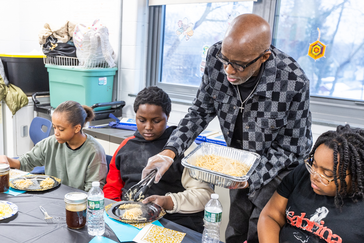 Students learning cooking techniques