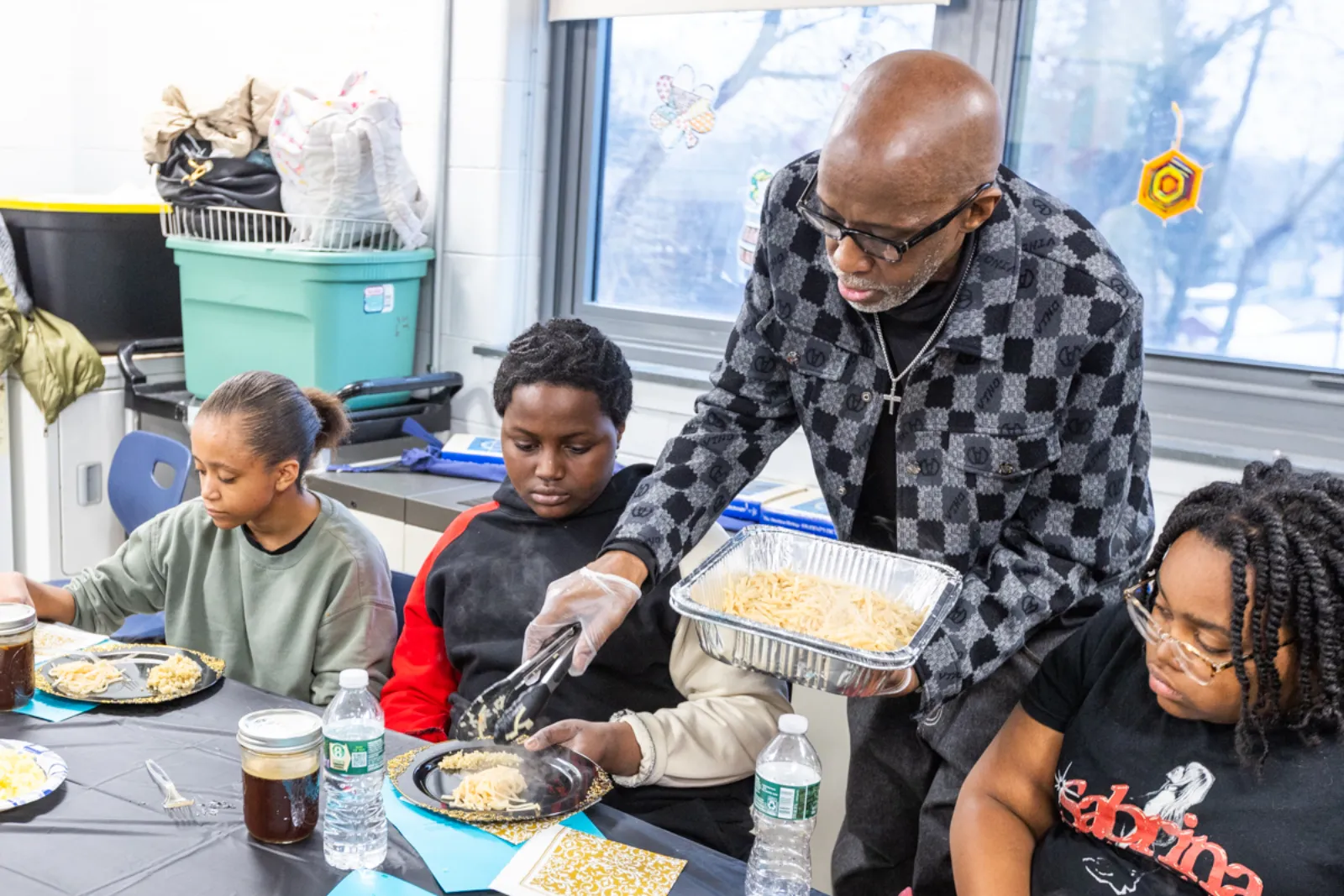 Students learning cooking techniques
